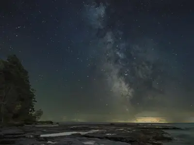 2022 1st Place Photo - Atmospheric night shot of the Milky Way glowing over Lake Erie, taken by Gary Crawford