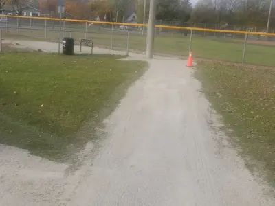 gravel path from a parking lot to ball diamond